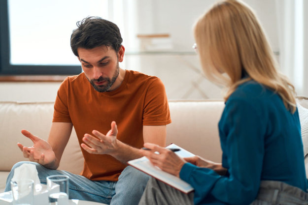 man talking to therapist about the connection between his mental health and substance abuse