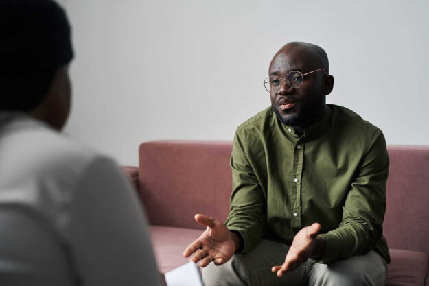 man talking to therapist about dual diagnosis treatment